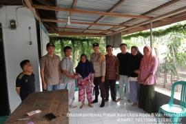 Bhabinkamtibmas Monitoring Penyaluran BLT DD di Desa Ulak Agung 