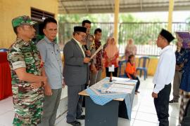 Bhabinkamtibmas Hadiri Pelantikan PAW BPD Lubuk Gedang