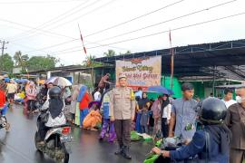 Bhabinkamtibmas Polres BU Laksanakan Pengamanan menyambut Tahun Baru Hijriah didesa Binaan